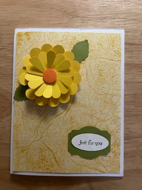 picture of a card with a 3 dimensional yellow flower and a yellow background.