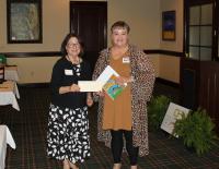 Twin Lakes Community Foundation board member, Estella Tullgren, presenting the grant to Mandy Bennett, Baxter County Early Literacy Project representative and Dolly Parton Imagination Library Coordinator for Baxter County