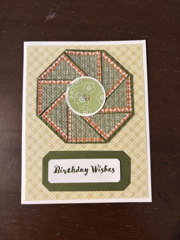 A handmade greeting card in brown, tan, and green. Happy Birthday is the memo on it.