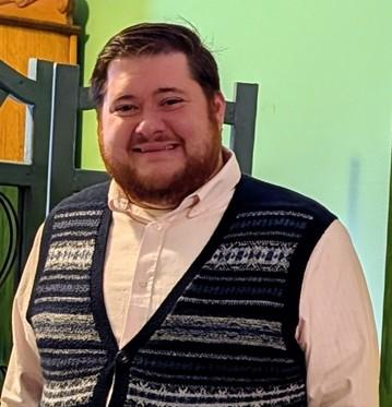 picture of David Norris with a green background.